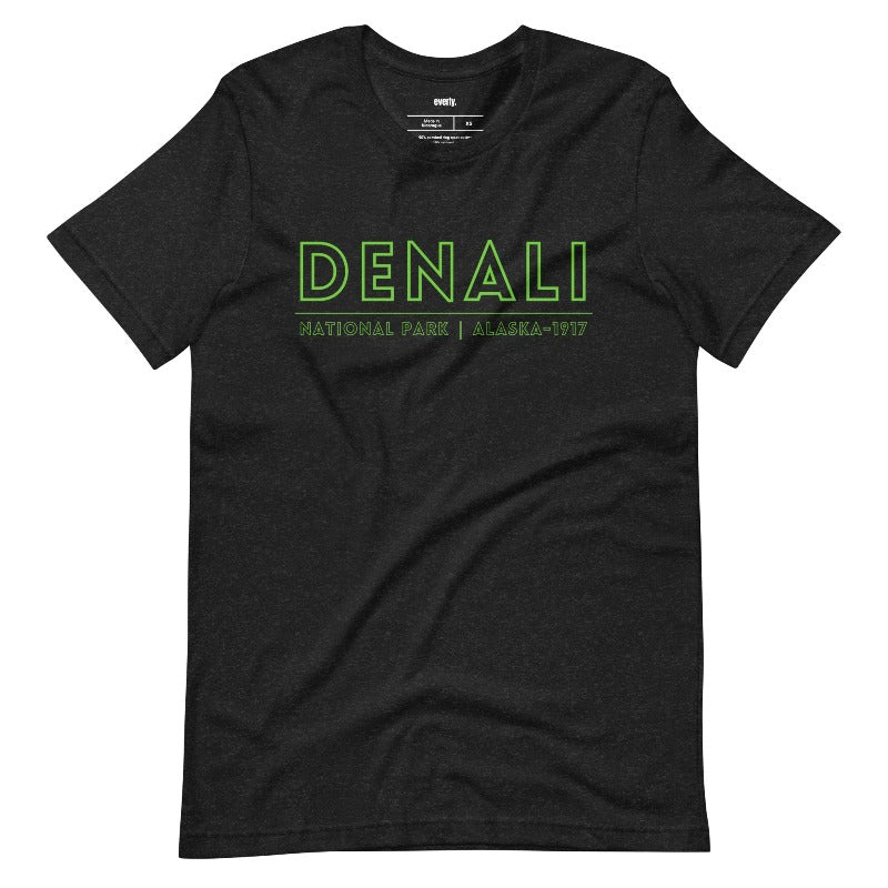 Black Bella + Canvas 3001 t-shirt with front and back Denali National Park designs. The front features "Denali National Park | Alaska - 1917" in neon green text, and the back showcases a colorful, detailed illustration of Denali's landscapes and wildlife.