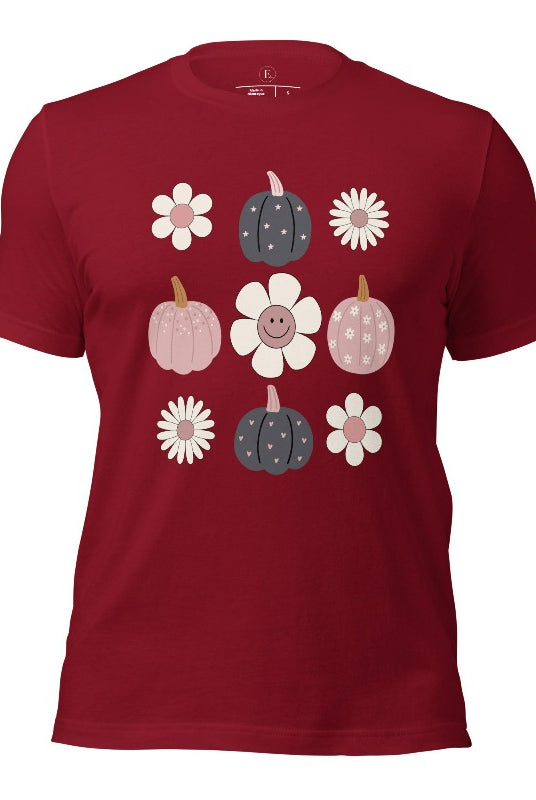 Step into retro autumn vibes with our trendy t-shirt. Featuring a delightful combination of pumpkins and retro flowers, on a cardinal colored shirt. 