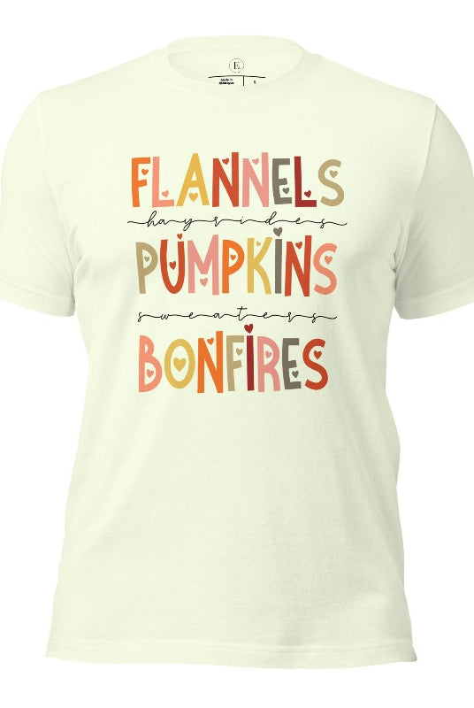 Embrace the cozy spirit of fall with our Flannel, Hayrides, Pumpkins, Sweaters, Bonfires shirt. Featuring the iconic fall elements, this shirt celebrates the season of warmth and comfort on a citron colored shirt. 