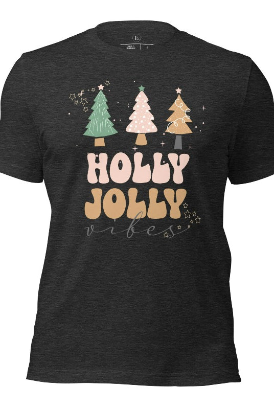 Get ready to feel the holly jolly vibes with our Christmas shirt! This festive shirt features a playful message that reads "Holly Jolly Vibes" and is adorned with cheerful Christmas trees, radiating the holiday cheer on a dark grey heather  shirt.