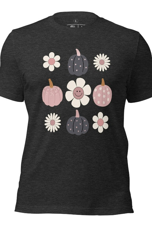Step into retro autumn vibes with our trendy t-shirt. Featuring a delightful combination of pumpkins and retro flowers, on a dark grey heather shirt. 