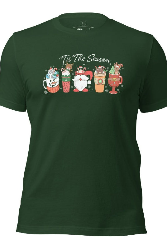 Wrap yourself in cozy holiday vibes with our Christmas coffee cup shirt. With a festive design that says "Tis The Season," this shirt captures the essence of warmth and joy on this forest green colored shirt. 