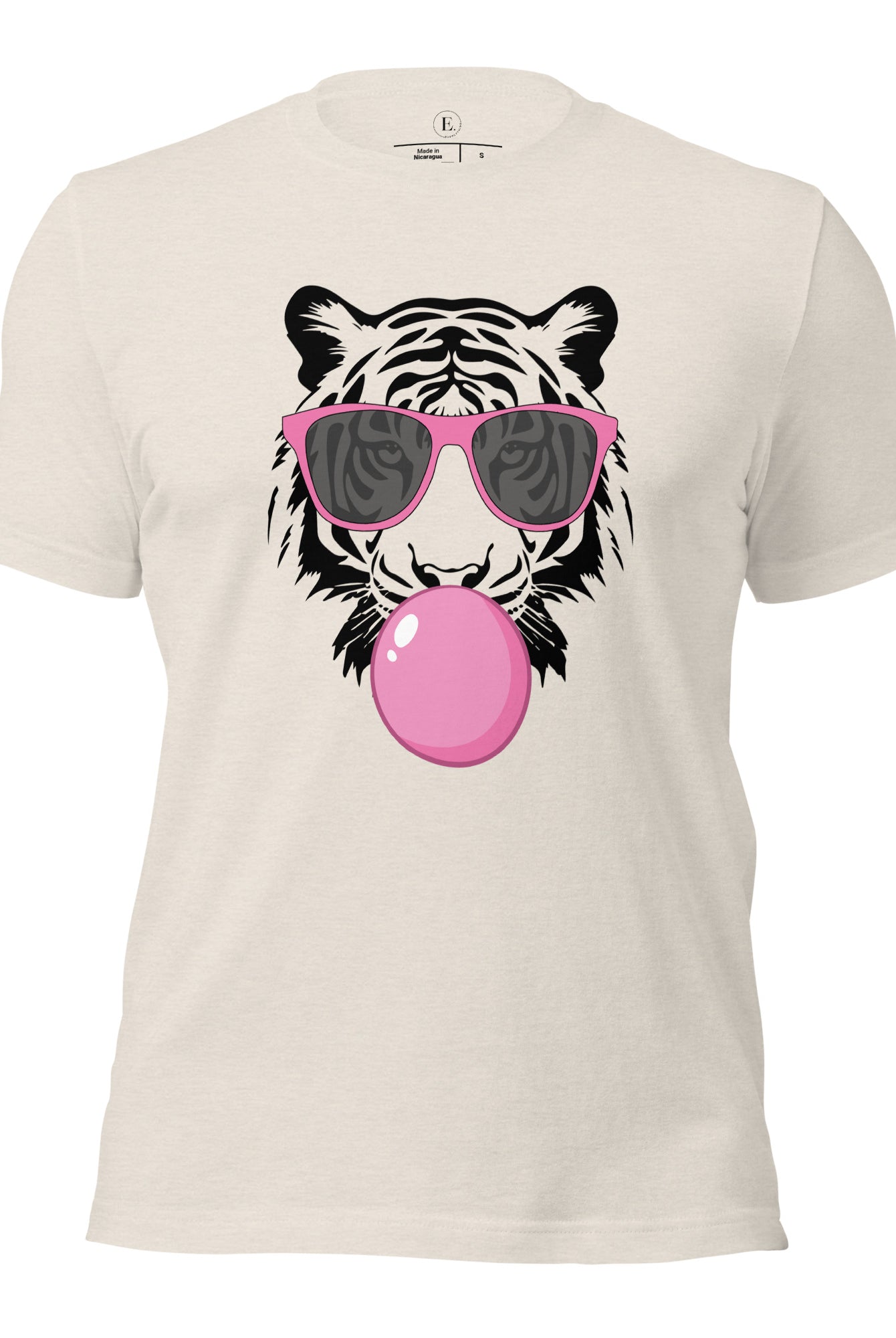 Bubble blowing tiger wearing pink sunglasses on a heather dust colored shirt. 
