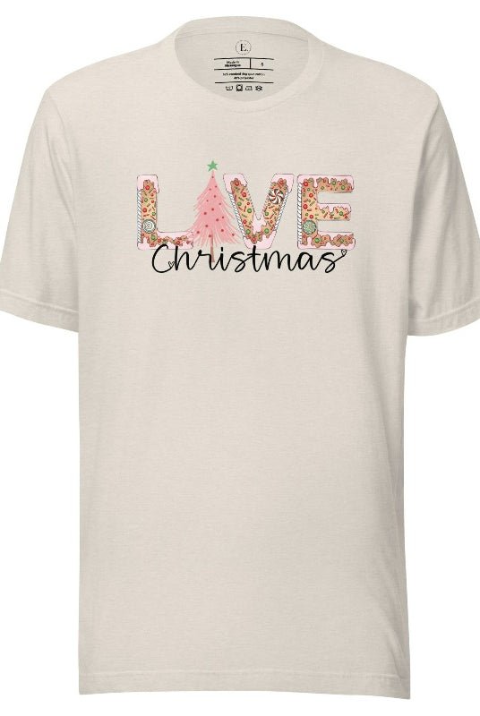 Get ready to celebrate the holiday season in style with our Christmas shirt featuring cute gingerbread cookies arranged to spell out the word "Love" on a heather dust colored shirt.