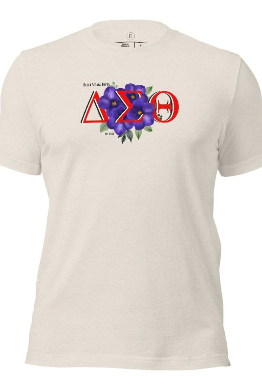 Show off your Delta Sigma Theta sisterhood with our exclusive sorority t-shirt design! The t-shirt features the sorority's letters along with the vibrant African violet, symbolizing empowerment, strength, and courage on a heather dust shirt. 
