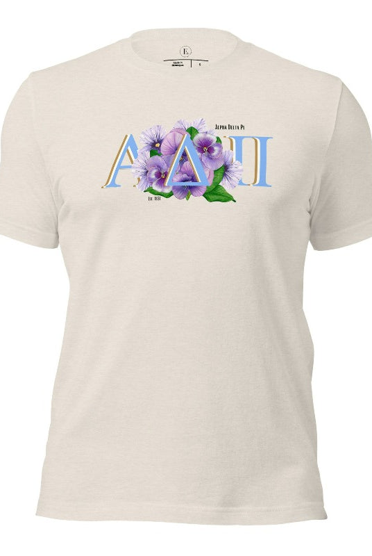 Show your Alpha Delta Pi pride with our stylish t-shirt featuring the sorority letters and the iconic violet, their symbolic flower on a heather dust shirt. 