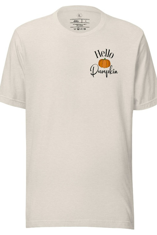 Say hello to autumn with our adorable t-shirt. It features a pumpkin on the front pocket and the playful phrase 'Hello Pumpkin,' this design captures the spirit of the season on a heather dust colored shirt. 