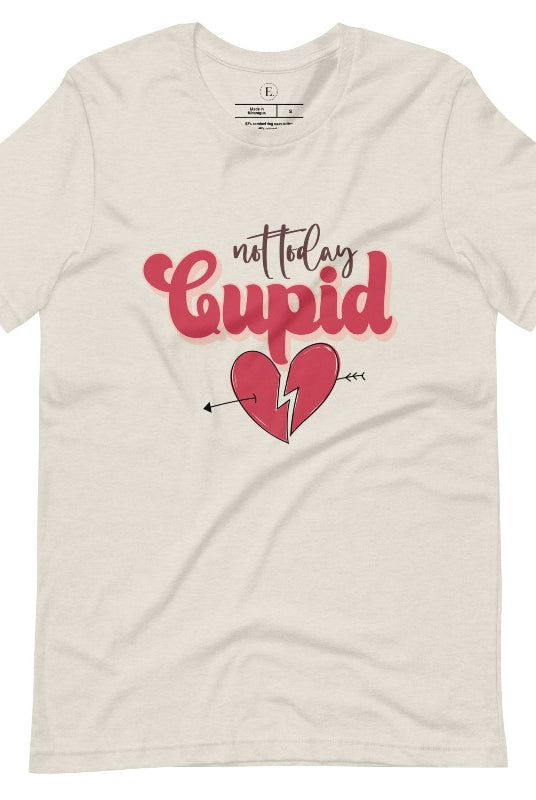 Spice up your Valentine's Day with our edgy shirt featuring a broken heart pierced by an arrow, and the defiant phrase "Not Today Cupid" on a heather dust colored shirt. 