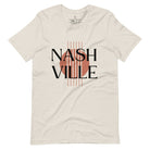 Capture the essence of Nashville with our minimalistic country western T-shirt. Featuring the iconic word "Nashville" with guitar strings silhouette, on a heather dust colored shirt. 