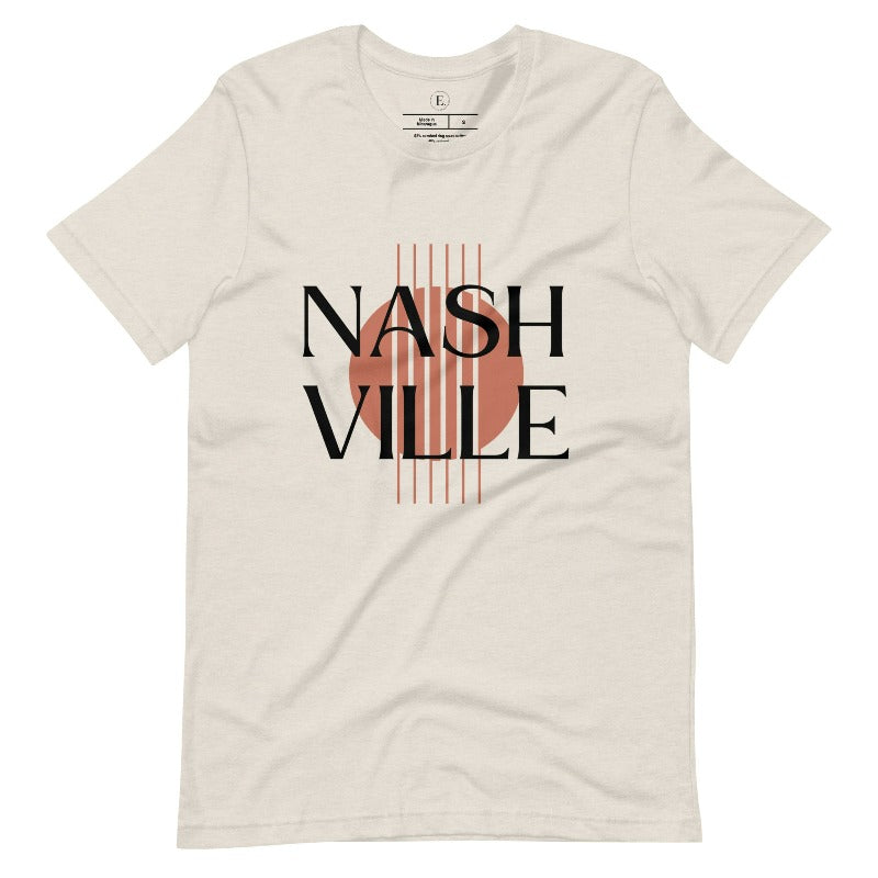 Capture the essence of Nashville with our minimalistic country western T-shirt. Featuring the iconic word "Nashville" with guitar strings silhouette, on a heather dust colored shirt. 