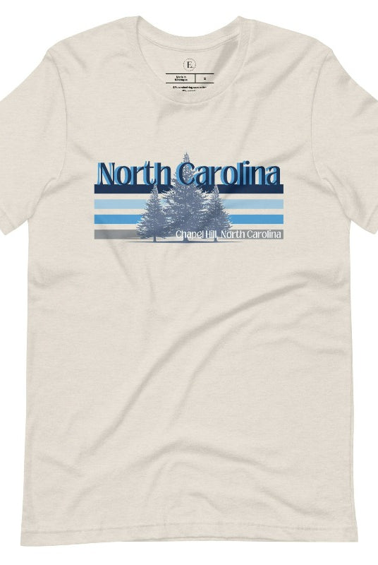 Show your school pride with this iconic North Carolina wordmark t-shirt. Made from premium materials, it features a North Carolina tree line in a the cool Carolina blue colors, representing a tradition of excellence for the nature that North Carolina offers on a heather dust shirt. 