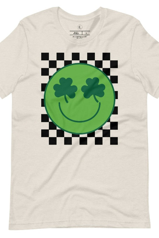 Get in the Saint Patrick's Day spirit with our Bella Canvas 3001 unisex graphic t-shirt! This unique design features a retro green smiley face with shamrock eyes, perfect for those seeking a festive and nostalgic look on a heather dust colored shirt. 