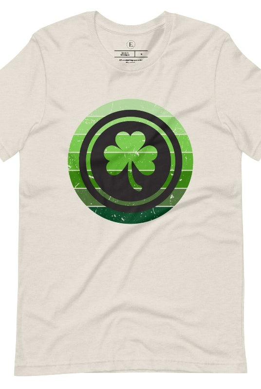 Get your ultimate Saint Patrick's Day attire with our Bella Canvas 3001 unisex graphic t-shirt! Featuring a captivating circle design in various shades of green, topped with a prominent shamrock, on a heather dust colored shirt. 