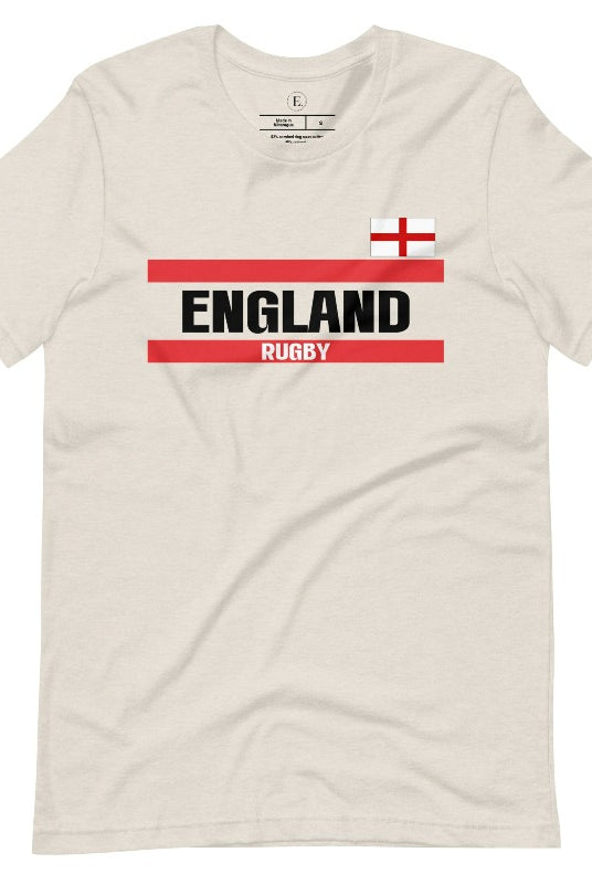 Introducing our England Rugby Graphic T-Shirt - made for rugby fans who want to show off their pride in a stylish and contemporary way! Featuring the words "England Rugby" and the iconic England flag, on a heather dust colored shirt. 