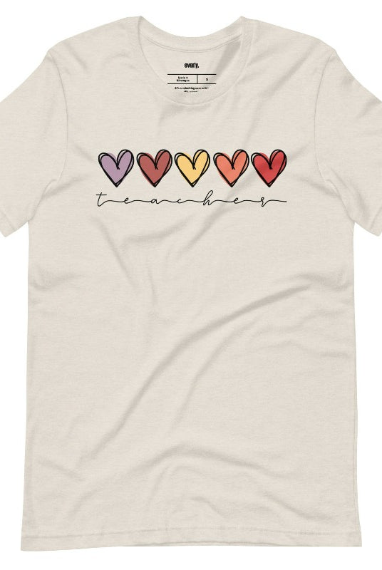 Modern heart design on a cream graphic tee with the word 'teacher' - perfect for teacher shirts and teacher gifts. Cream graphic tees.