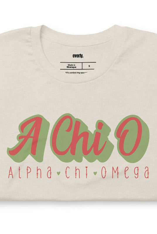 Stylish A Chi O Alpha Chi Omega graphic tee perfect for sorority shirts, featuring retro design and classic comfort. Cream Graphic Tee