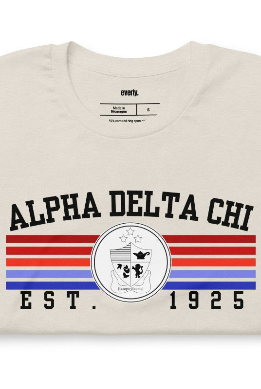 Heather dust graphic tee featuring the Alpha Delta Chi sorority letters and crest
