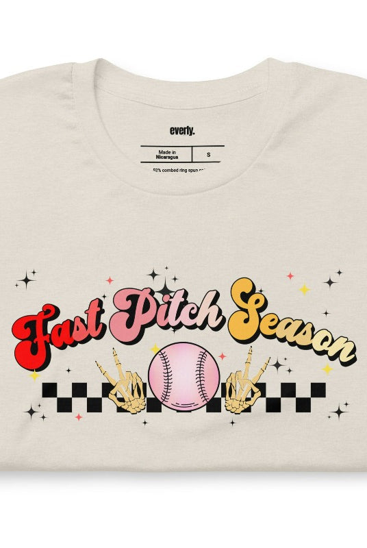 Fast pitch softball retro graphic design on a heather dust tee.