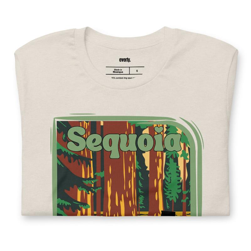 a vibrant illustration of Sequoia National Park, showcasing towering sequoia trees with a vintage-inspired design on a beige shirt.