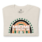 Bella + Canvas 3001 unisex shirt featuring a rainbow design in orange, green, and black with "Miami" text and decorative hearts and dots on a beige shirt.