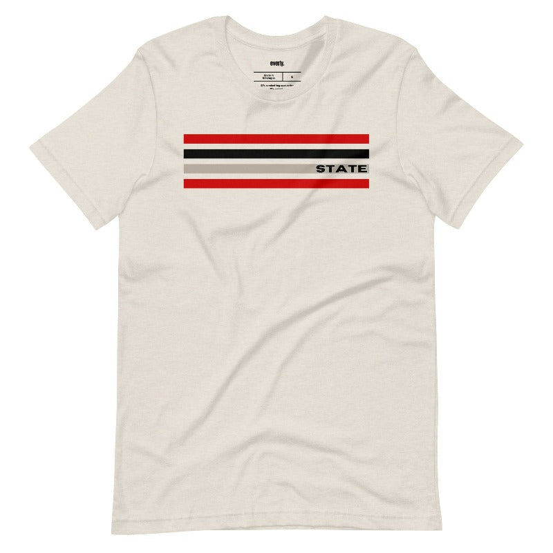 Bold red, black, and grey stripes with "STATE" text for NC State on a beige shirt.