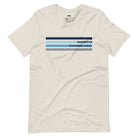 a design featuring blue stripes and "North Carolina" text on a beige shirt.