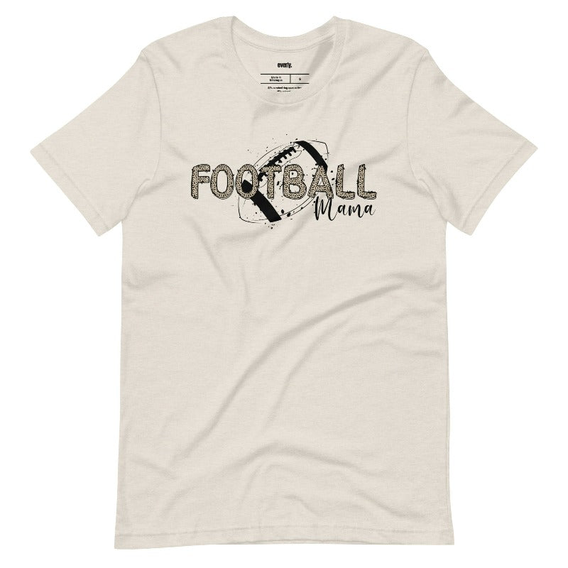 a playful design with a football graphic and the words "Football Mama" in leopard print on a beige shirt.