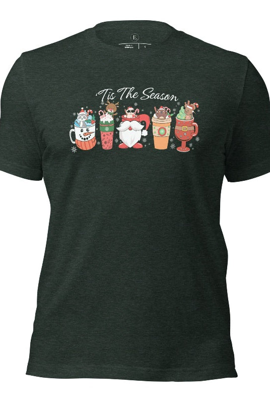 Wrap yourself in cozy holiday vibes with our Christmas coffee cup shirt. With a festive design that says "Tis The Season," this shirt captures the essence of warmth and joy on this heather forest green colored shirt. 