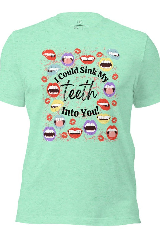 Sink your teeth into Halloween style with our vampire lips shirt. Adorned with a collection of seductive vampire lips, this shirt mesmerizes with its allure. The cheeky message, 'I could sink my teeth into you,' adds a playful twist on a heather mint colored shirt. 