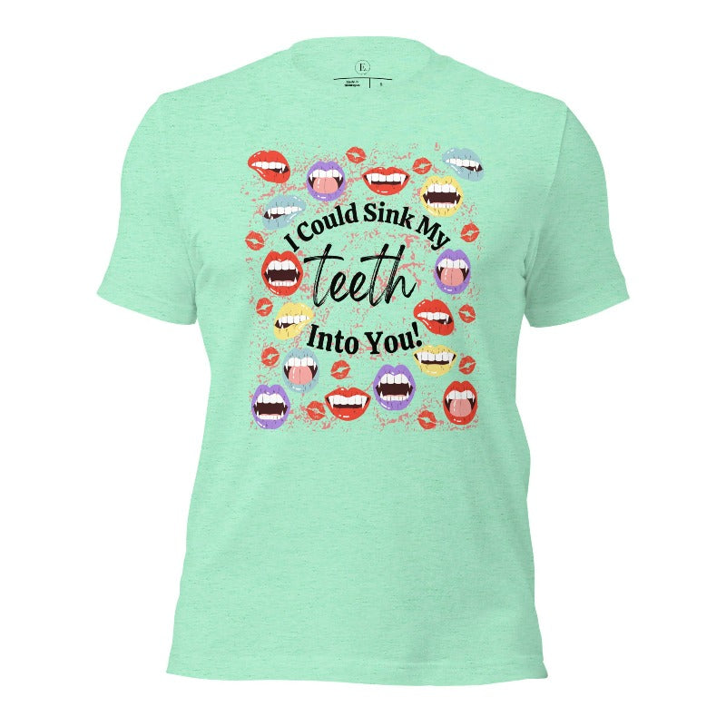 Sink your teeth into Halloween style with our vampire lips shirt. Adorned with a collection of seductive vampire lips, this shirt mesmerizes with its allure. The cheeky message, 'I could sink my teeth into you,' adds a playful twist on a heather mint colored shirt. 