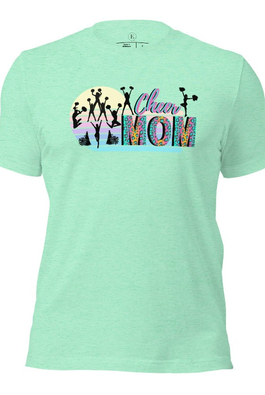 Get your cheer on with our stylish cheer mom shirt. Perfect for proud moms supporting their cheering stars. Made with love, this shirt combines comfort and fashion, letting you show off your team spirit. Join the cheer squad and cheer your heart out in style on a heather mint shirt. 