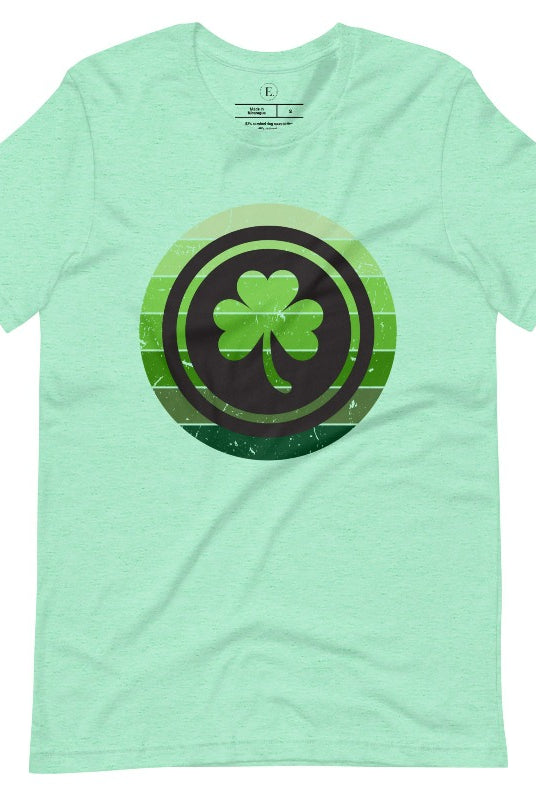 Get your ultimate Saint Patrick's Day attire with our Bella Canvas 3001 unisex graphic t-shirt! Featuring a captivating circle design in various shades of green, topped with a prominent shamrock, on a heather mint shirt.