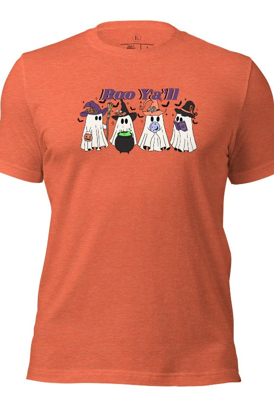 Embrace the spirit of Halloween with our spooktacular shirt. Join a mischievous gang of ghostly trick-or-treaters as they spread frightening fun. Featuring a playful 'Boo Ya'll' message, on a heather orange shirt. 