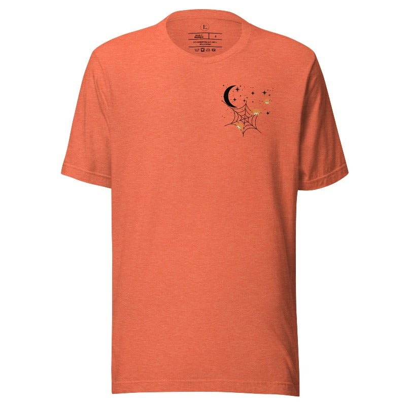 Embrace the enchanting night sky with our captivating t-shirt. Featuring a crescent moon, stars, and a spiderweb with three adorable spiders hanging down on the front pocket on a heather orange shirt. 