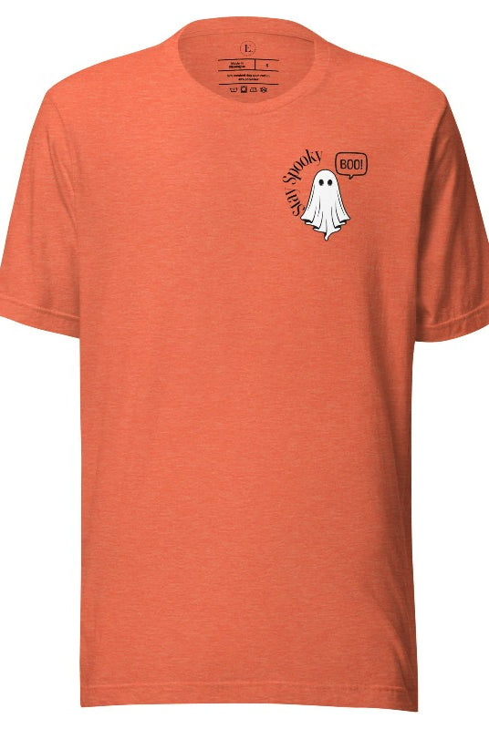 Get into the Halloween spirit with our spooktacular t-shirt. Featuring a friendly ghost holding a sign that says 'Boo' and the playful phrase "Stay Spooky" on a heather orange shirt. 
