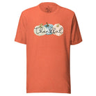 Express gratitude in style with our charming t-shirt. This design radiates autumn appreciation, featuring three pastel pumpkins and the word 'thankful' gracefully woven through the middle on a heather orange colored shirt. 