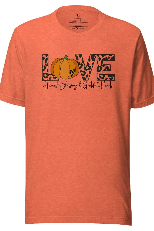 Spread love and autumn vibes with our trendy t-shirt. Featuring the word 'love' in cheetah print with a pumpkin as the 'o,' and "Harvest Blessings and Grateful Hearts' underneath on an heather orange shirt. 