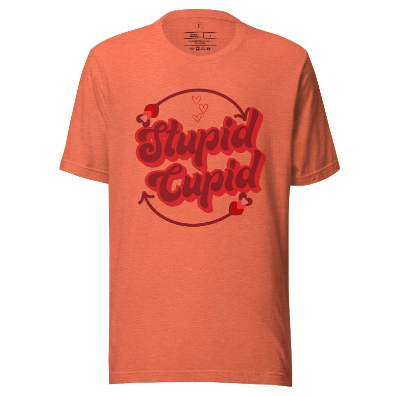 Express your Valentine's Day attitude with our bold and cheeky shirt proclaiming "Stupid Cupid" on a heather orange shirt. 