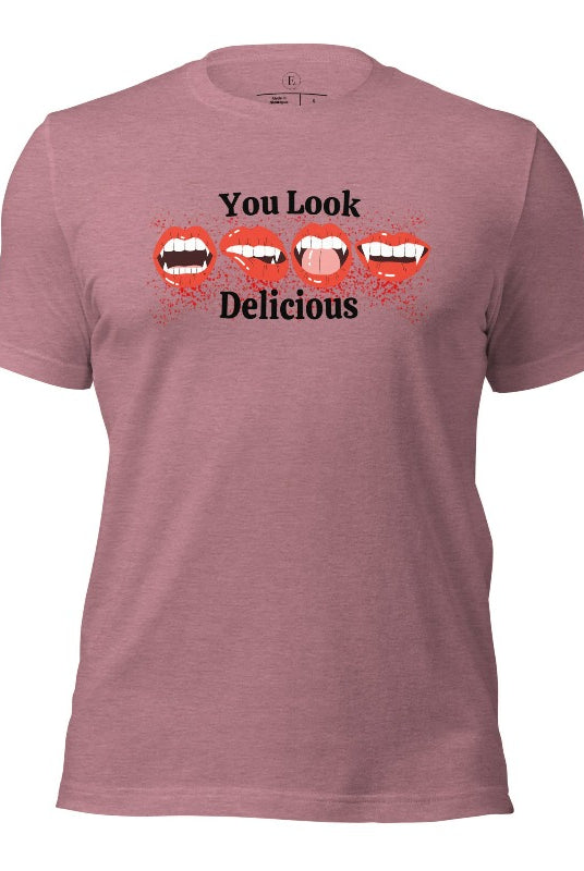 Indulge in wickedly delightful style with our vampire lips shirt. Featuring alluring lips dripping with Halloween allure, this shirt captivates with its seductive charm. The cheeky message, 'You Look Delicious,' on a heather orchid colored shirt. 