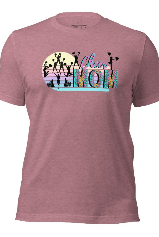 Get your cheer on with our stylish cheer mom shirt. Perfect for proud moms supporting their cheering stars. Made with love, this shirt combines comfort and fashion, letting you show off your team spirit. Join the cheer squad and cheer your heart out in style on a heather orchid colored shirt. 