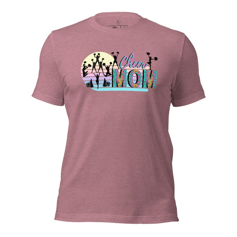 Get your cheer on with our stylish cheer mom shirt. Perfect for proud moms supporting their cheering stars. Made with love, this shirt combines comfort and fashion, letting you show off your team spirit. Join the cheer squad and cheer your heart out in style on a heather orchid colored shirt. 