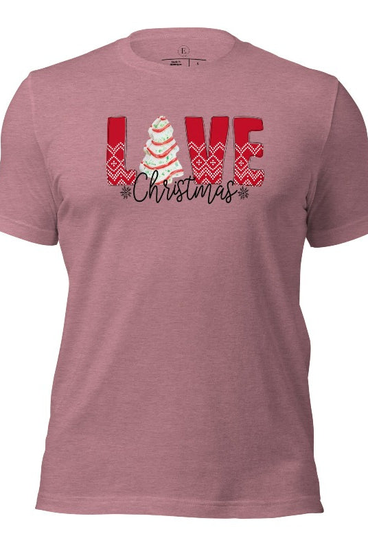 Spread love and joy this holiday season with our Christmas shirt featuring the classic Christmas tree cake, which is incorporated into the word "Love" on a heather orchid colored shirt.
