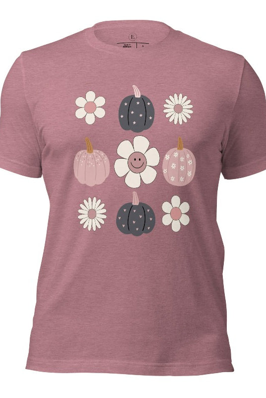 Step into retro autumn vibes with our trendy t-shirt. Featuring a delightful combination of pumpkins and retro flowers, on a heather orchid colored shirt. 