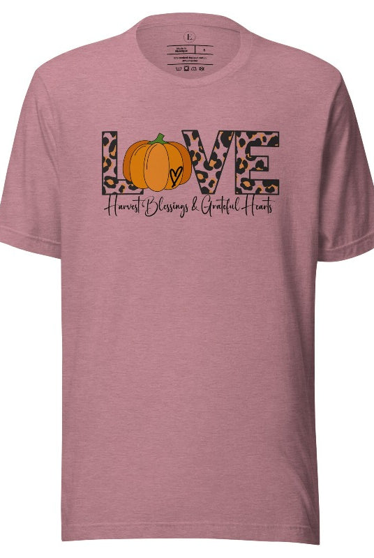 Spread love and autumn vibes with our trendy t-shirt. Featuring the word 'love' in cheetah print with a pumpkin as the 'o,' and "Harvest Blessings and Grateful Hearts' underneath on a heather orchid shirt. 