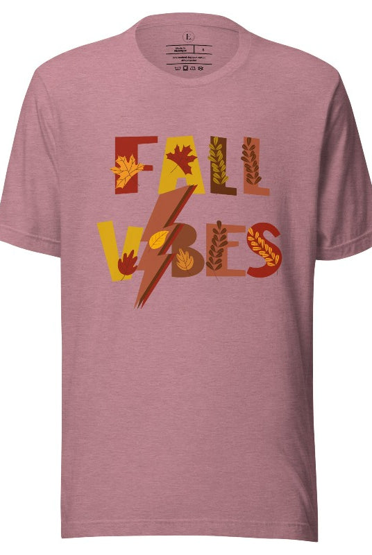 Get into the autumn spirit with our Fall Vibes shirt. Featuring the words 'Fall Vibes' with a creative twist- a lighting bolt replacing the 'I'- this shirt captures the energy of the season. Adorned with leaves, it adds a touch of nature's beauty on a heather orchid colored shirt. 