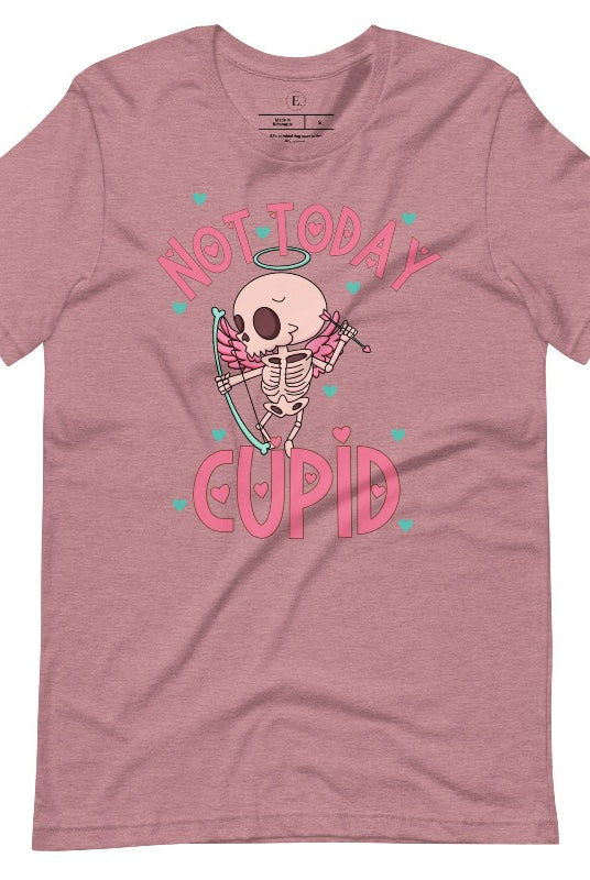 Unleash your rebellious spirit this Valentine's Day with our edgy shirt featuring a skeleton Cupid. The bold "Not Today Cupid" message adds a touch of attitude, making this tee a standout choice for those who march to the beat of their own drum on a heather orchid colored shirt. 