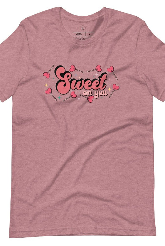Spread the love with our charming Valentine's Day shirt featuring the endearing phrase " Sweet on You" surrounded by heart lollipops on a heather orchid colored shirt. 