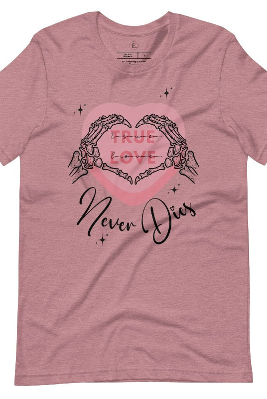 Embrace the unconventional with our Valentine's Day shirt featuring the bold statement "True Love, Never Dies" adorned with a heart and skeleton hands forming a heart shape on a heather orchid colored shirt. 