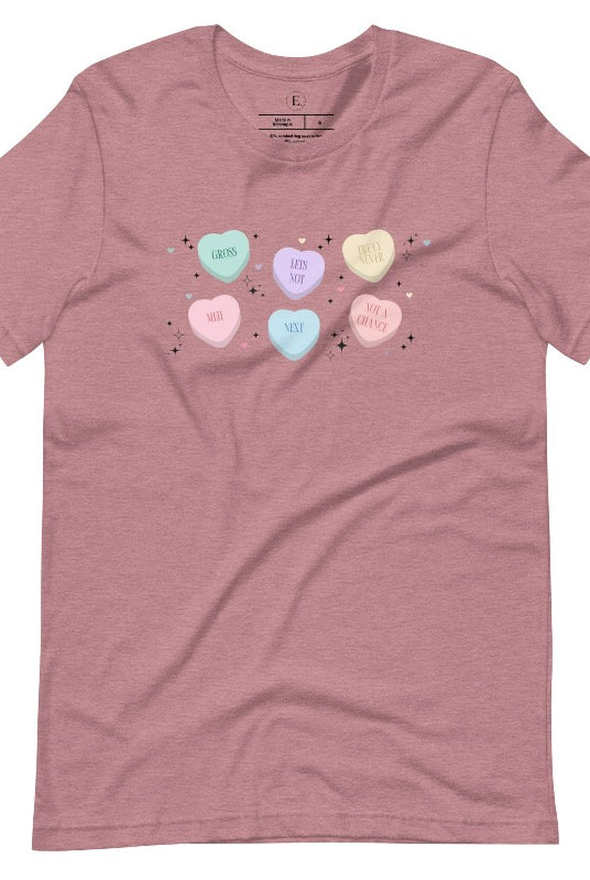 Embrace a humorous take on Valentine's Day with our shirt featuring candy hearts with unconventional messages like "Gross," "Not a Chance," "Next," "Truly Never," "Meh," "Not a Chance," and "Let's Not" on a heather orchid colored shirt. 