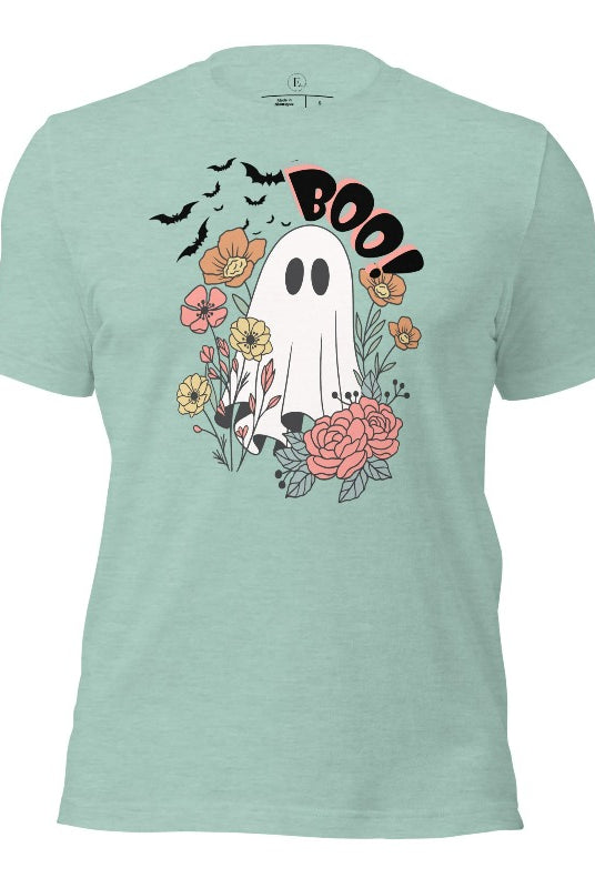 Get ready for Halloween with our cute and spooky ghost-themed shirt! Featuring a whimsical design with a cute ghost, flowers, and bats in a starry sky, it's the perfect blend of spooky and sweet on a heather prism dusty blue shirt. 